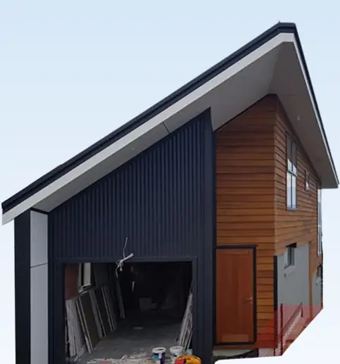 Home with dark vertical cladding and natural cedar weatherboards during construction